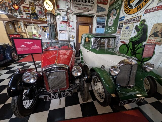 Classic cars inside Cotswold Motoring Museum